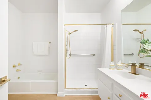 a bathroom with a bathtub and a sink