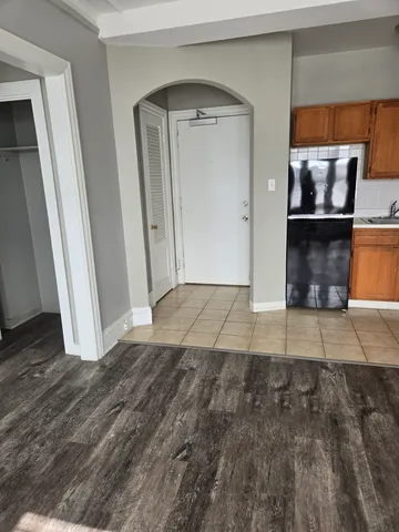 a view of a hallway view with wooden floor and staircase