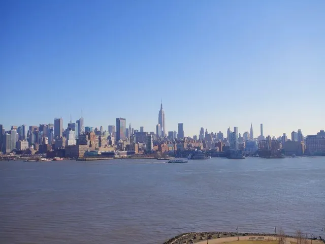 a swimming pool with outdoor seating