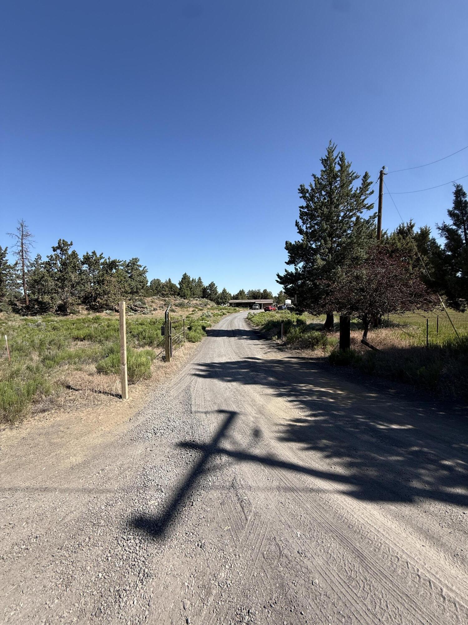 21710 McGilvray Road Bend, OR 97702 - Photo 4 of 7 a view of a road with an ocean view