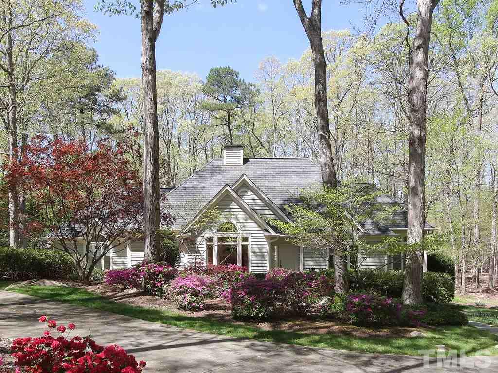 616 Booth Road Chapel Hill, NC 27516 - Photo 1 of 26 a front view of a house with yard and trees