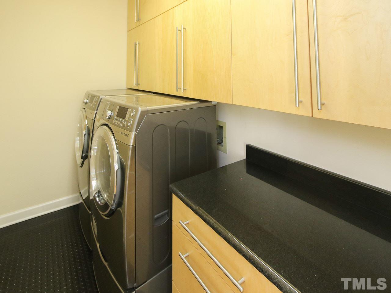 616 Booth Road Chapel Hill, NC 27516 - Photo 18 of 26 a utility room with dryer and washer