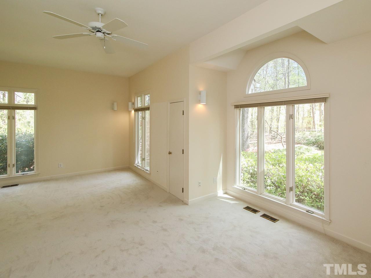 616 Booth Road Chapel Hill, NC 27516 - Photo 19 of 26 an empty room with a window and a chandelier