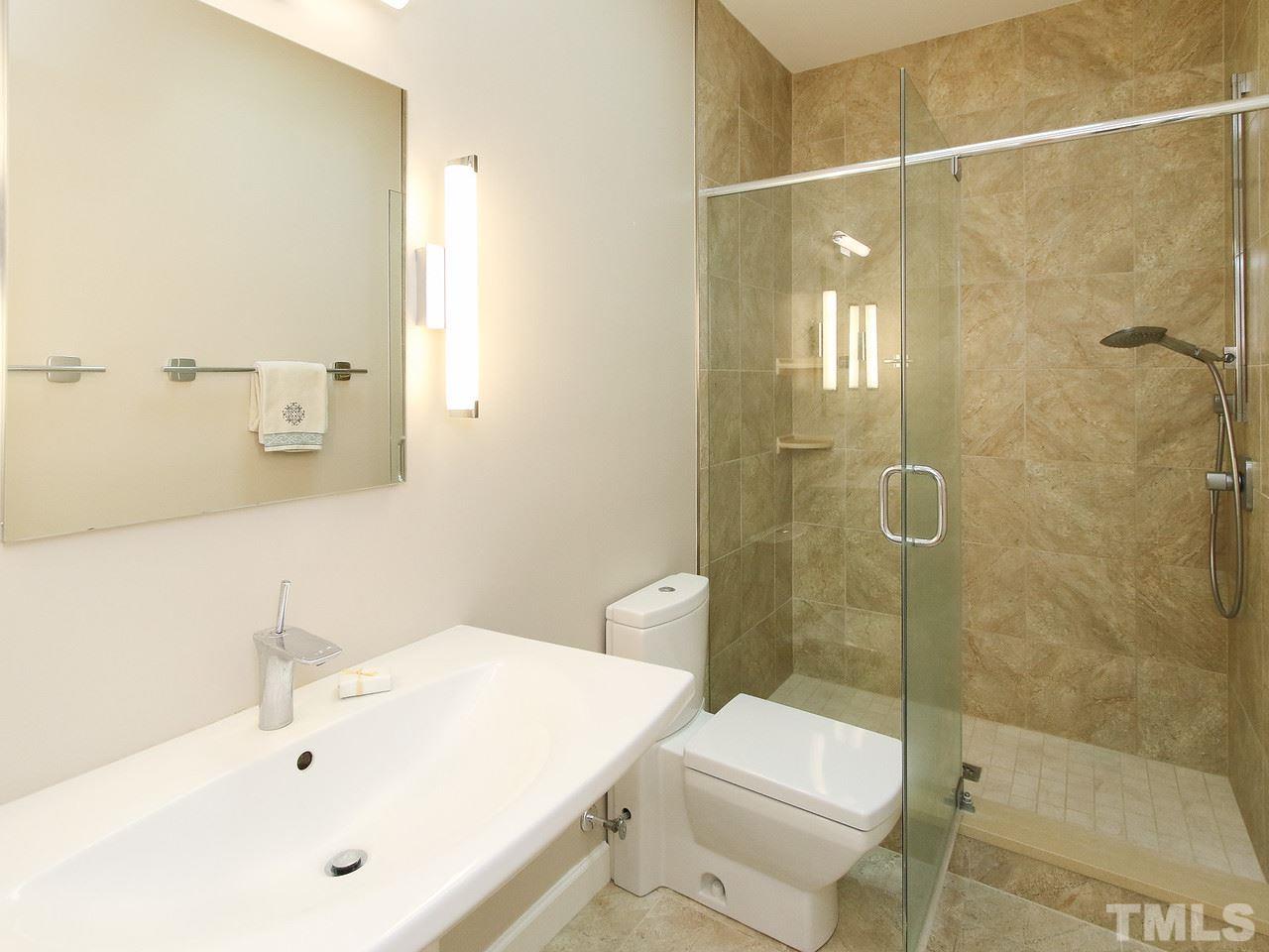 616 Booth Road Chapel Hill, NC 27516 - Photo 20 of 26 a bathroom with a sink toilet and shower