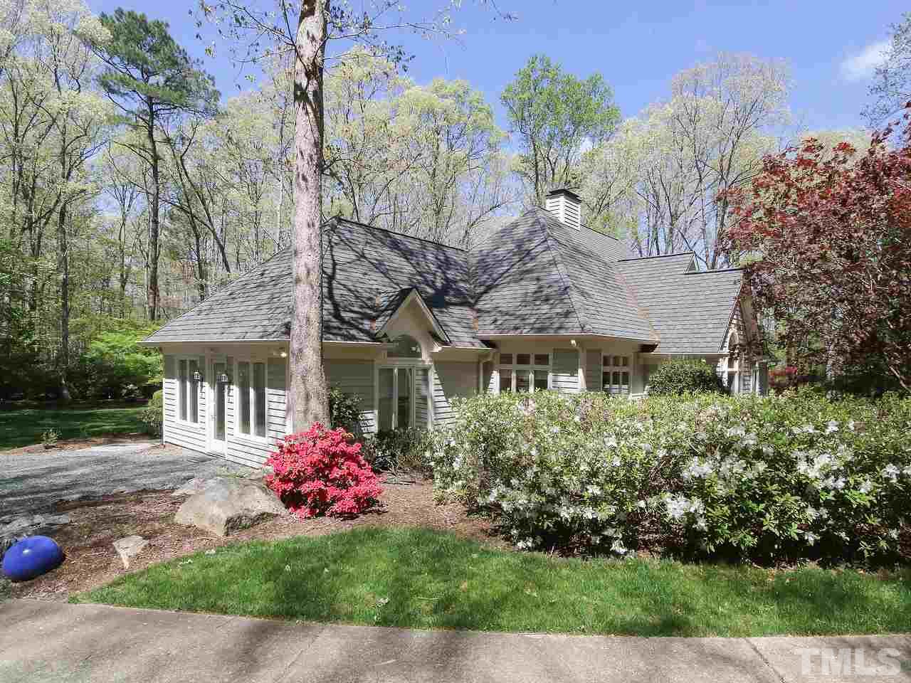 616 Booth Road Chapel Hill, NC 27516 - Photo 3 of 26 a front view of a house with a garden