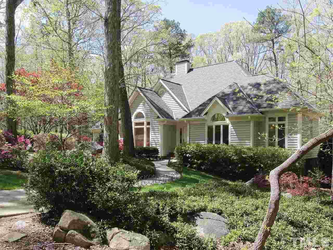 616 Booth Road Chapel Hill, NC 27516 - Photo 5 of 26 a view of house with a yard and potted plants