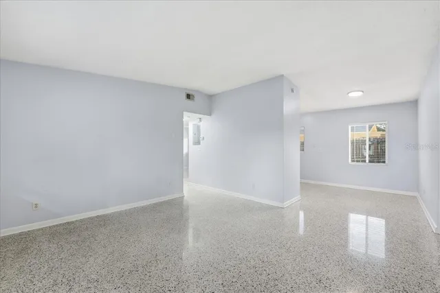 a view of an empty room with a window