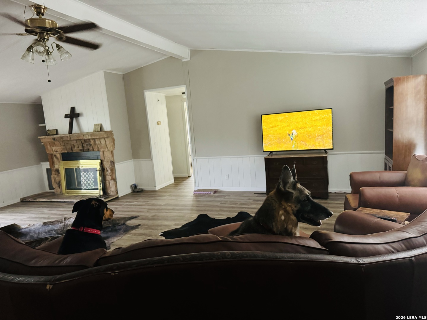 8790 Whartons Dock Road Bandera, TX 78003 - Photo 3 of 12 a room with furniture and a fireplace