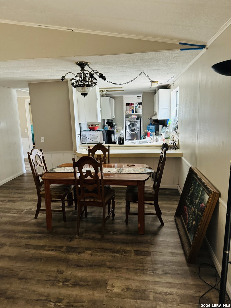 8790 Whartons Dock Road Bandera, TX 78003 - Photo 5 of 12 a view of a dining room with furniture and wooden floor