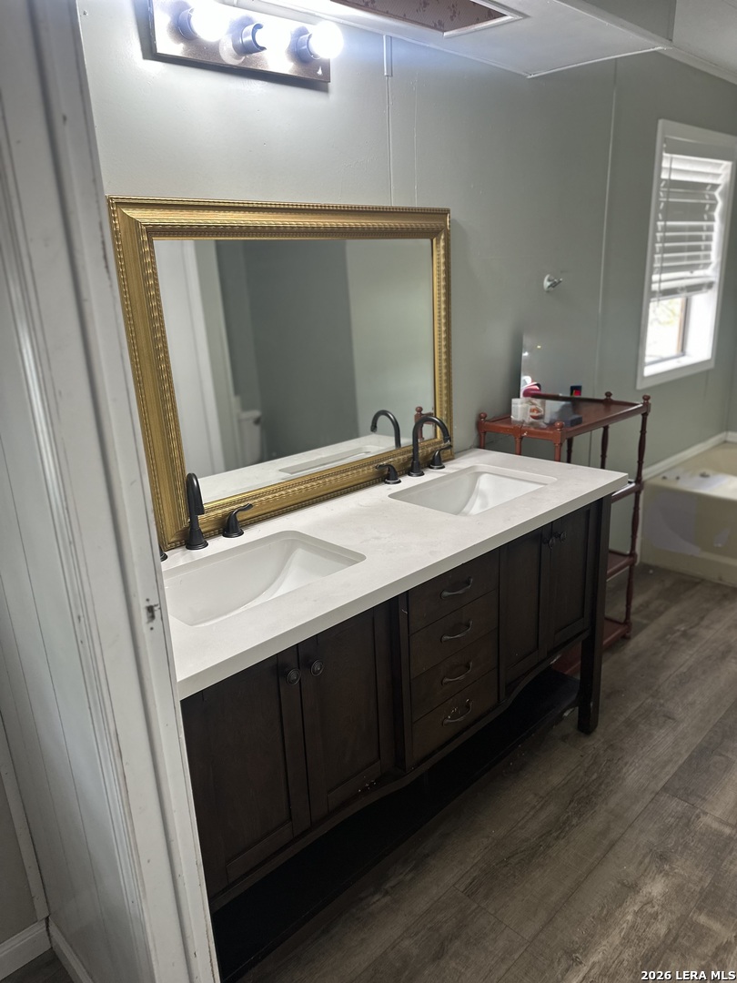 8790 Whartons Dock Road Bandera, TX 78003 - Photo 8 of 12 a bathroom with a sink and a mirror