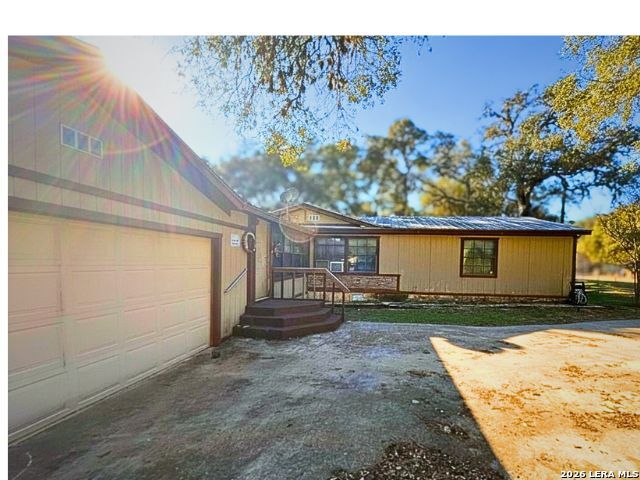 8790 Whartons Dock Road Bandera, TX 78003 - Photo 9 of 12 a house view with a backyard space