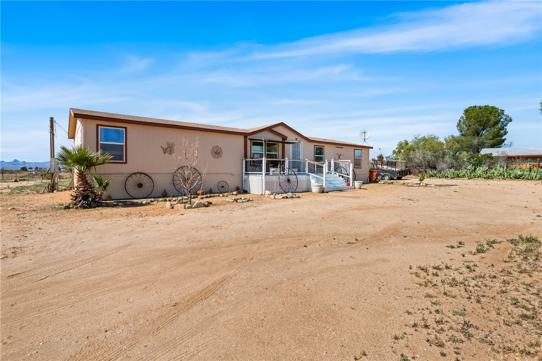 3411 Mayer Road Golden Valley, AZ 86413 - Photo 42 of 49 Rear view of house featuring a wooden deck