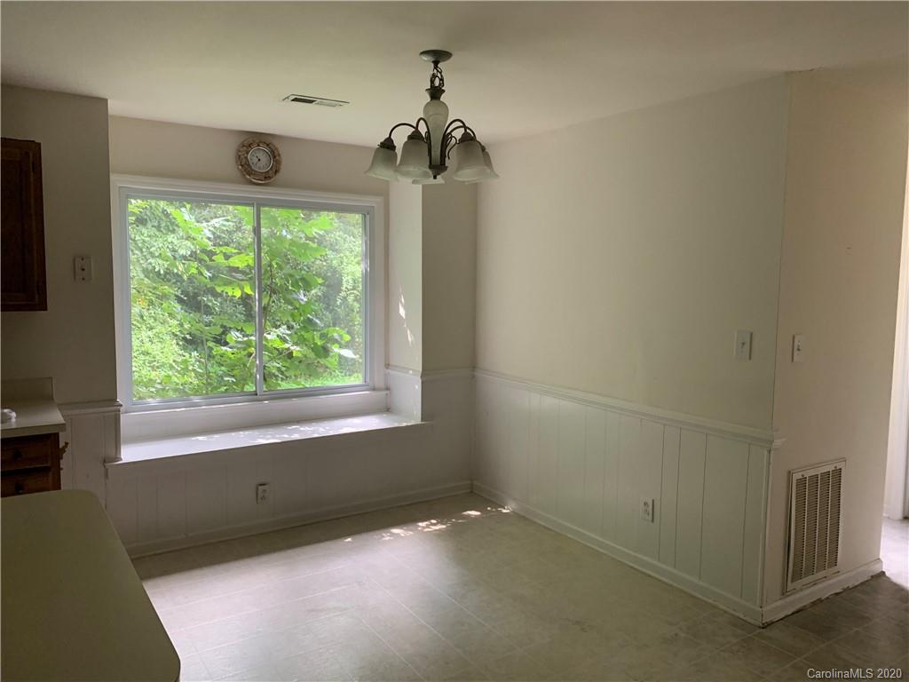 10107 Ridgemore Drive Charlotte, NC 28277 - Photo 4 of 7 an empty room with a window
