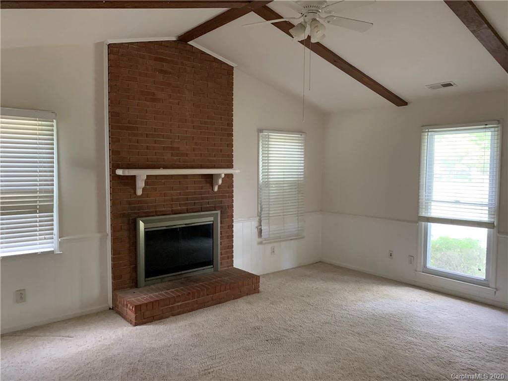 10107 Ridgemore Drive Charlotte, NC 28277 - Photo 5 of 7 a view of empty room with a fireplace