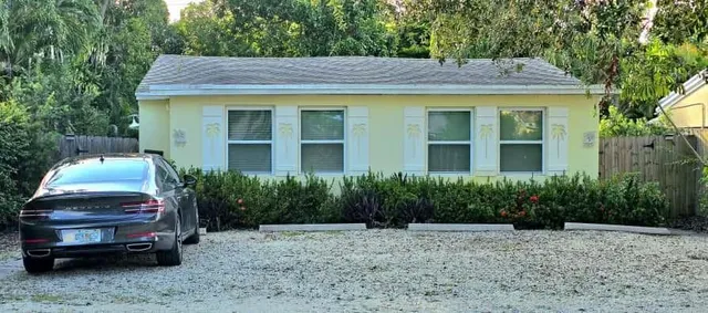 a car parked in front of a house