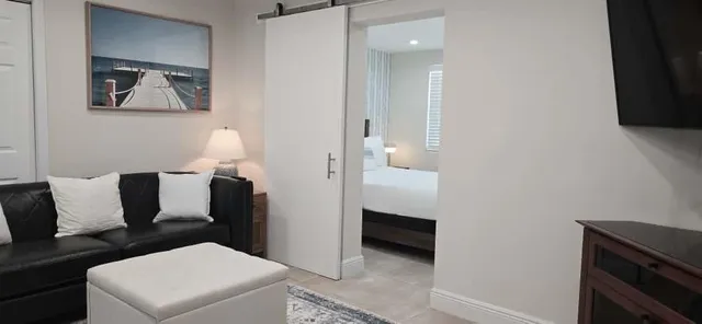 a living room with furniture and a table