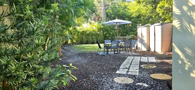a living room with furniture a window and a fireplace