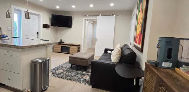 a bedroom with a large bed and a lamp with window