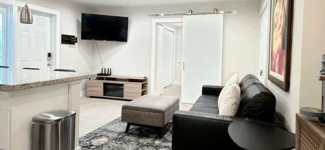 a bedroom with a bed and a flat screen tv