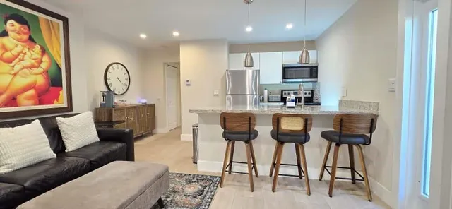 a bathroom with a sink a toilet a mirror and vanity