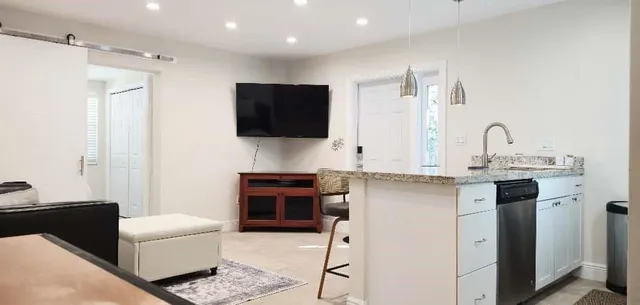 a living room with furniture and wall painting