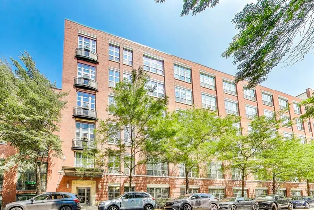 a front view of a building with street view