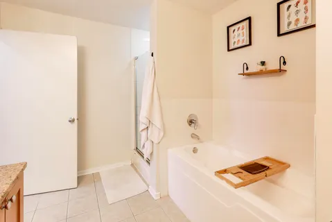 a bathroom with a bathtub and a shower