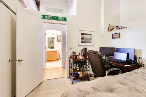 a view of a livingroom with workspace and a couch