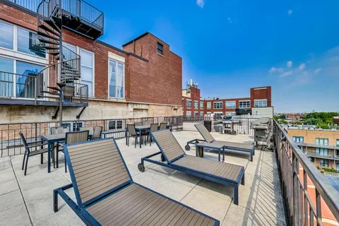 a view of a terrace with sitting area