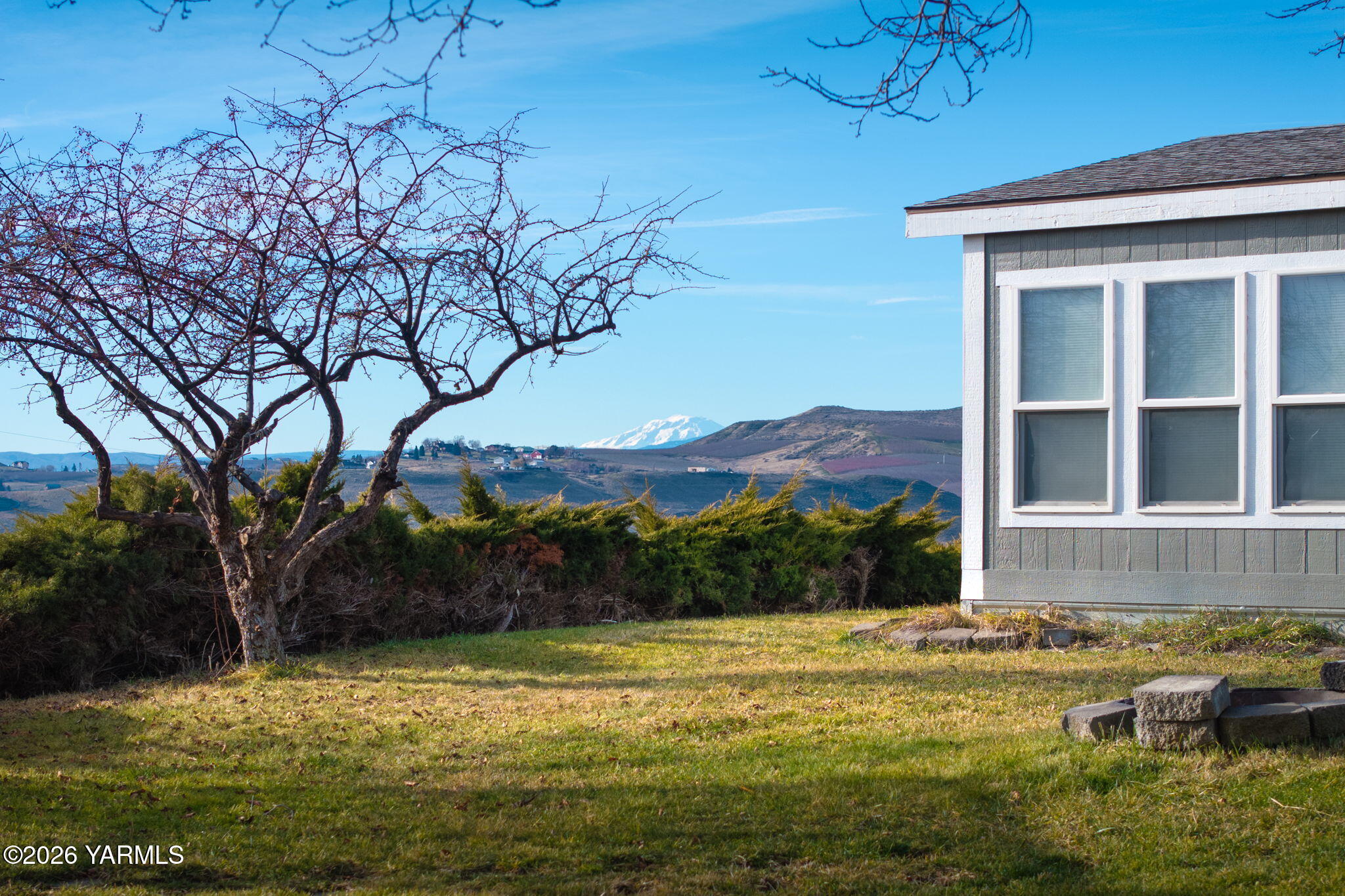 401 Clemans View Road Selah, WA 98942 - Photo 14 of 28 a view of a house with a yard