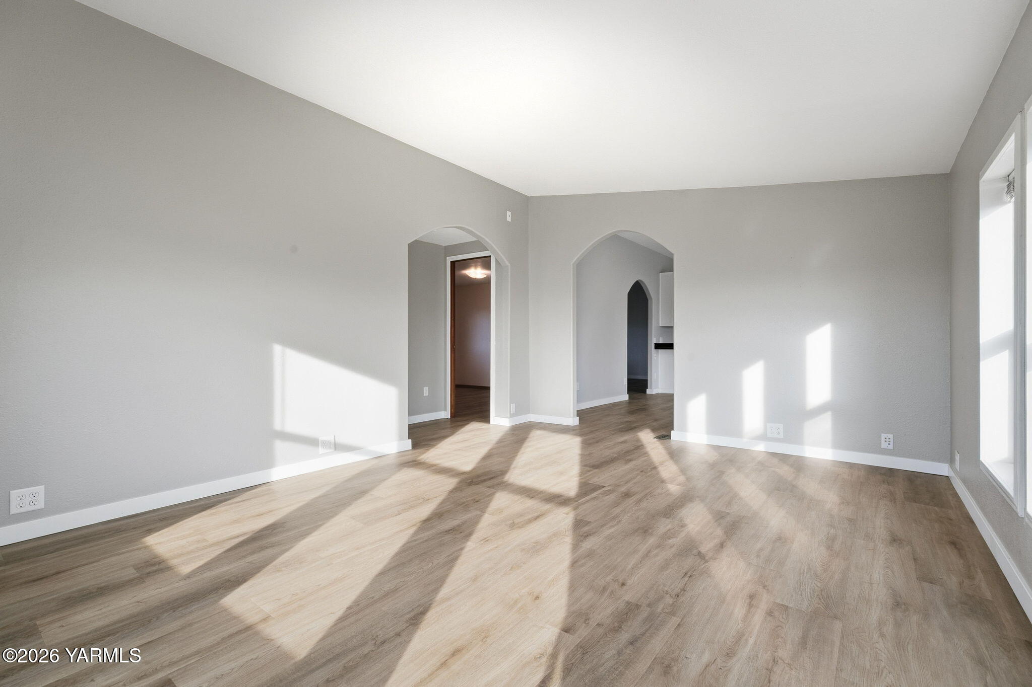 401 Clemans View Road Selah, WA 98942 - Photo 18 of 28 a view of empty room with wooden floor and fan