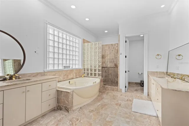 a spacious bedroom with a bed couch and a window