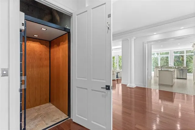 a bathroom with a granite countertop sink mirror vanity and toilet