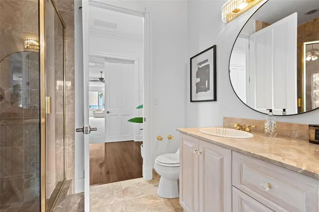a view of a hallway with wooden floor and stairs