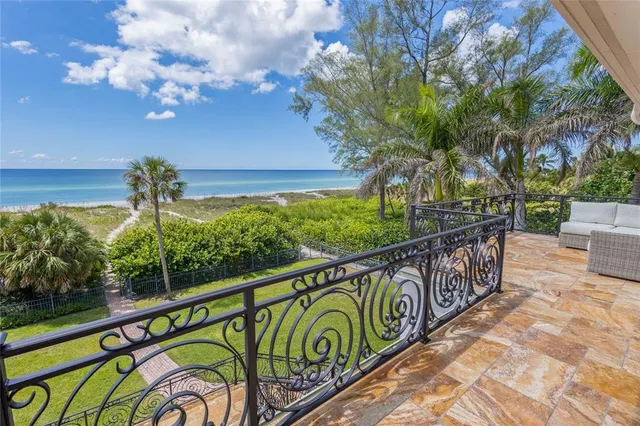 a bedroom with a bed and a dresser next to a window