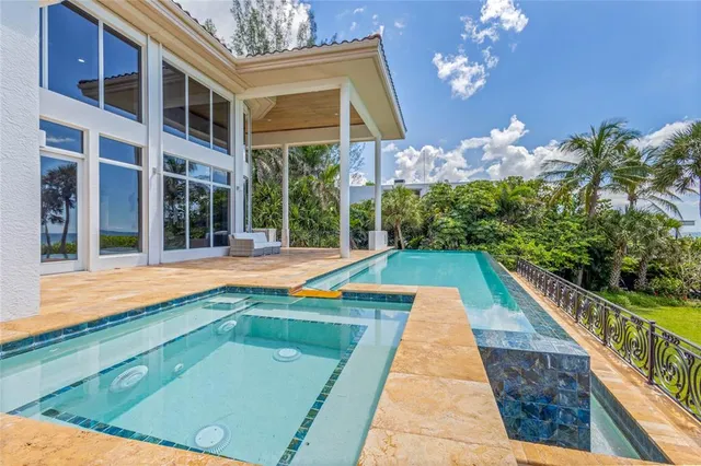 a view of a patio with table and chairs