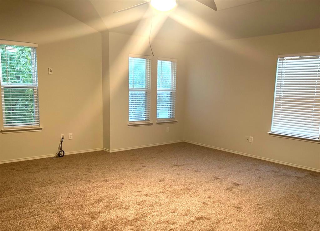 6904 Cotton Seed Drive McKinney, TX 75070 - Photo 6 of 10 an empty room with windows