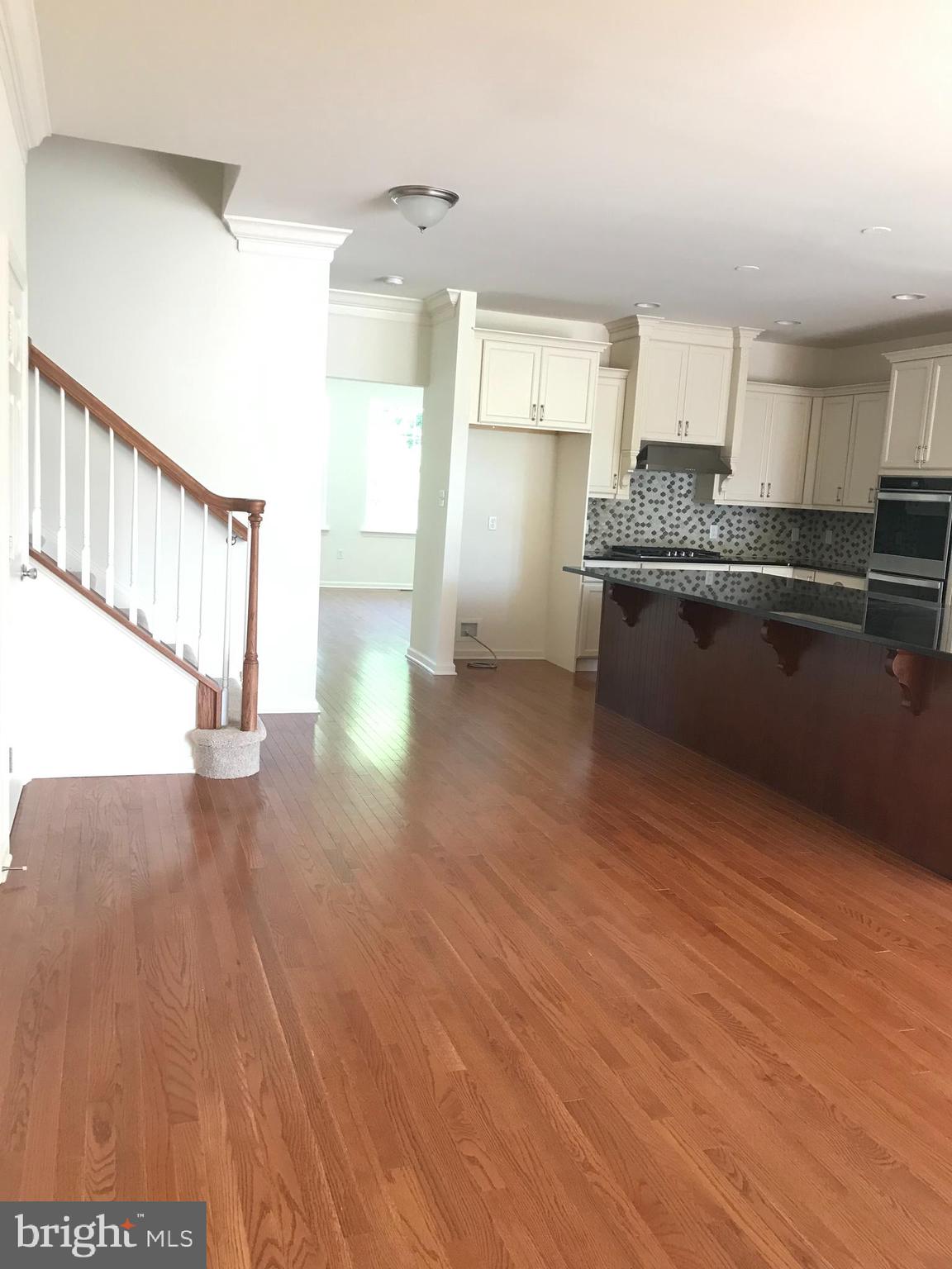 116 Grissom Drive Bear, DE 19701 - Photo 11 of 25 a kitchen with stainless steel appliances a refrigerator and a stove top oven