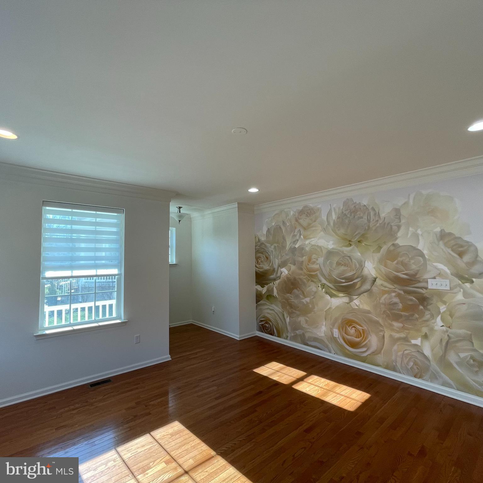 116 Grissom Drive Bear, DE 19701 - Photo 3 of 25 a view of empty room with wooden floor and fan
