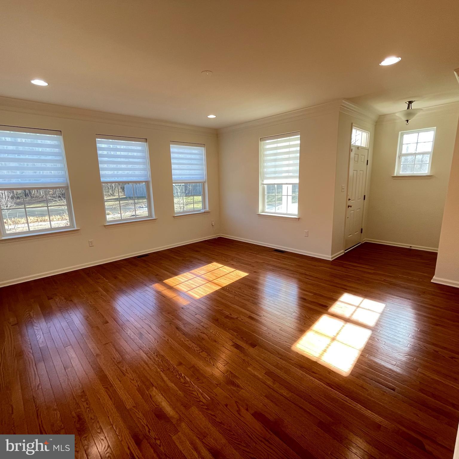 116 Grissom Drive Bear, DE 19701 - Photo 5 of 25 a view of an empty room with wooden floor and a window