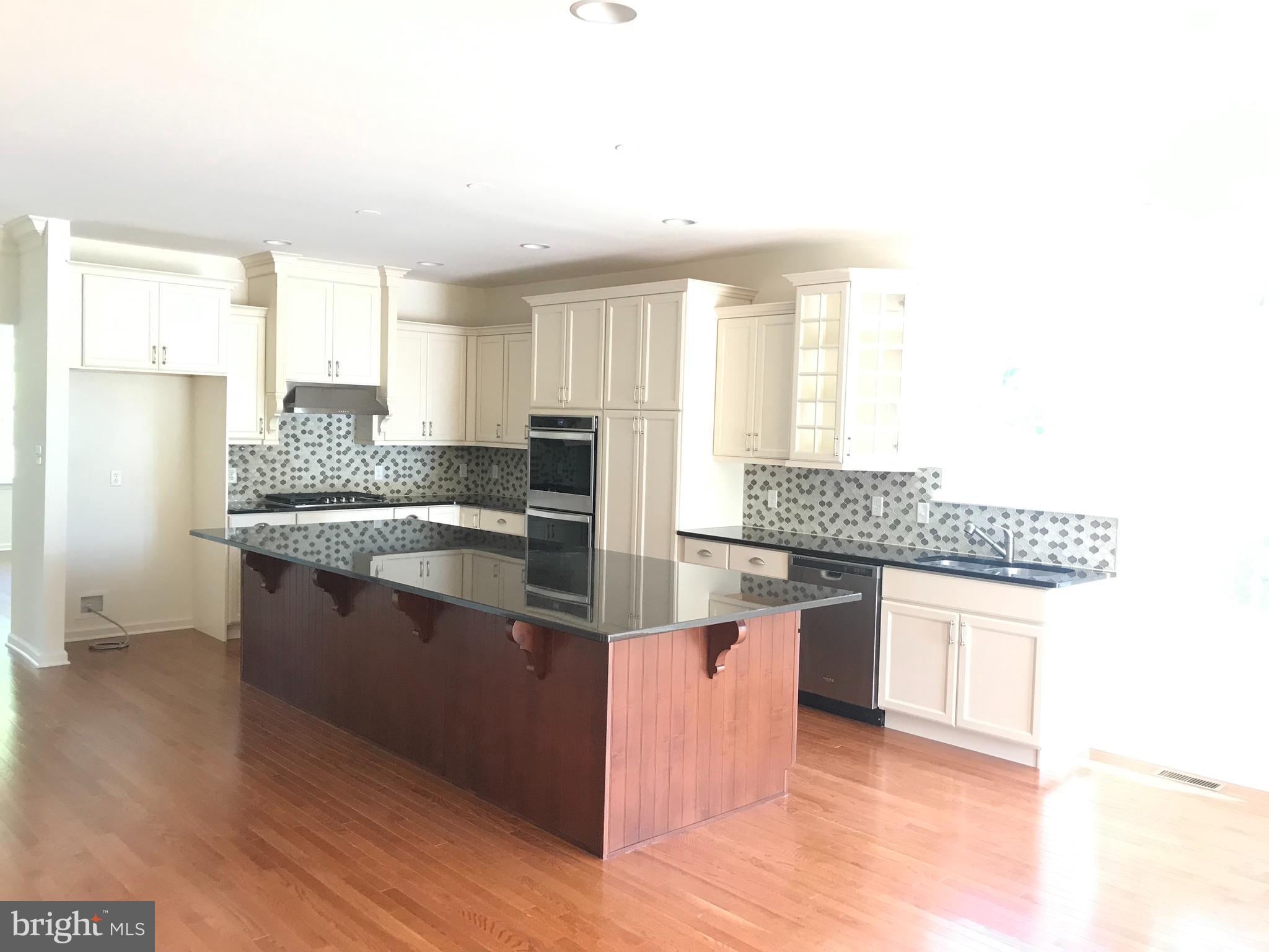 116 Grissom Drive Bear, DE 19701 - Photo 9 of 25 a kitchen with stainless steel appliances granite countertop a stove and a sink