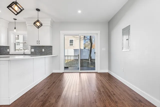 a view of a kitchen cabinets and wooden floor