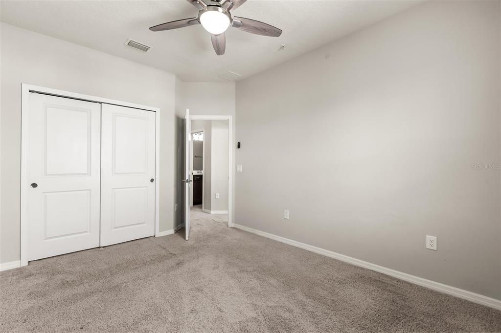 588 Piazza Point Oviedo, FL 32765 - Photo 44 of 66 an empty room with a fan and a chandelier fan
