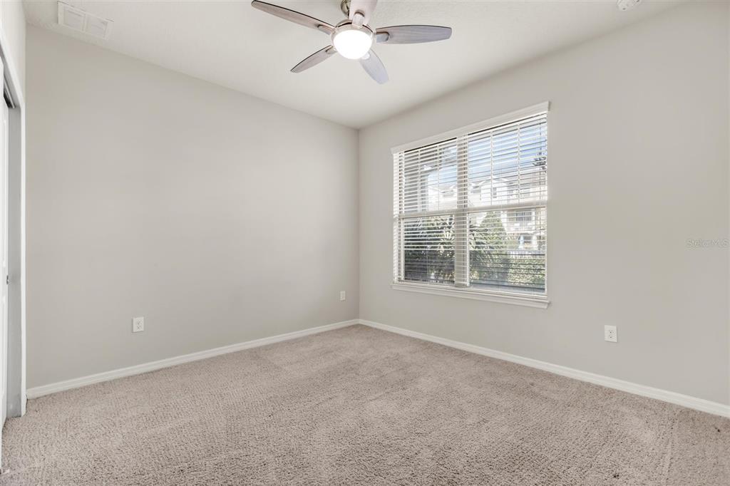 588 Piazza Point Oviedo, FL 32765 - Photo 47 of 66 an empty room with a window and a fan