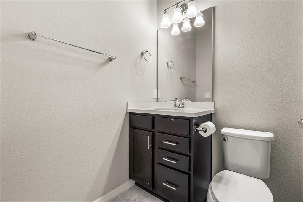 588 Piazza Point Oviedo, FL 32765 - Photo 48 of 66 a bathroom with a sink vanity mirror and toilet