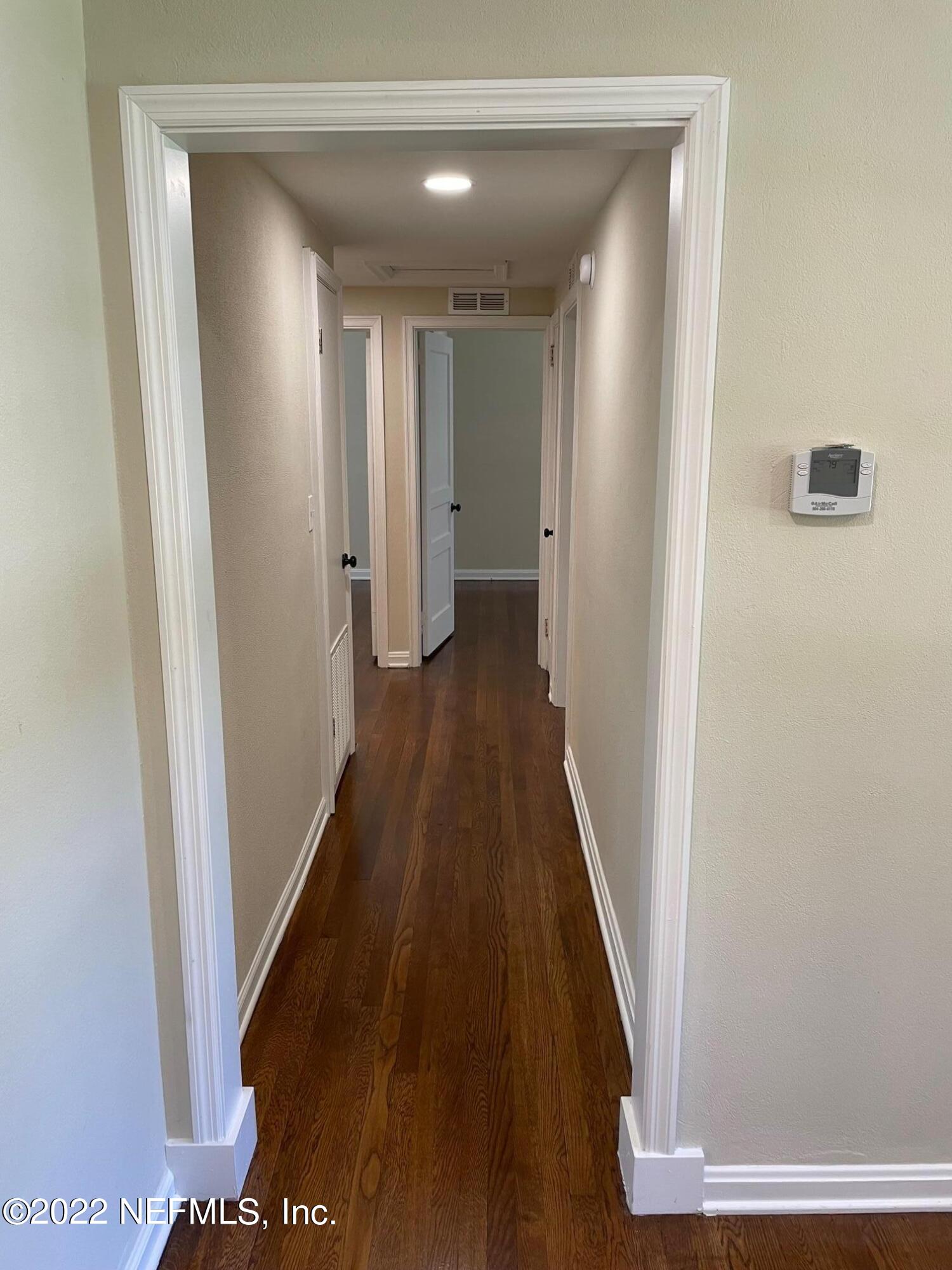 4520 Sunderland Road Jacksonville, FL 32210 - Photo 11 of 17 a view of a hallway with wooden floor
