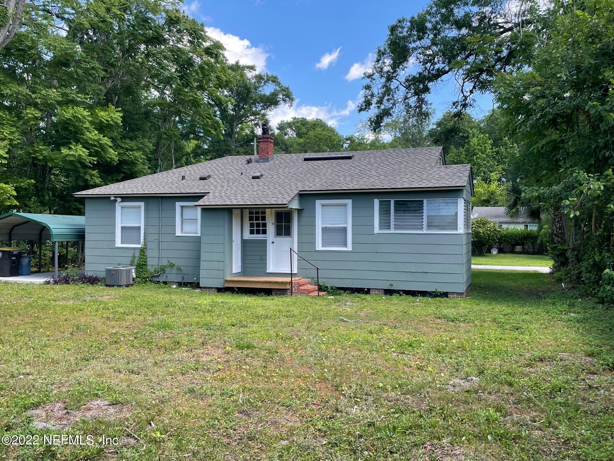 4520 Sunderland Road Jacksonville, FL 32210 - Photo 4 of 17 a house view with a garden space