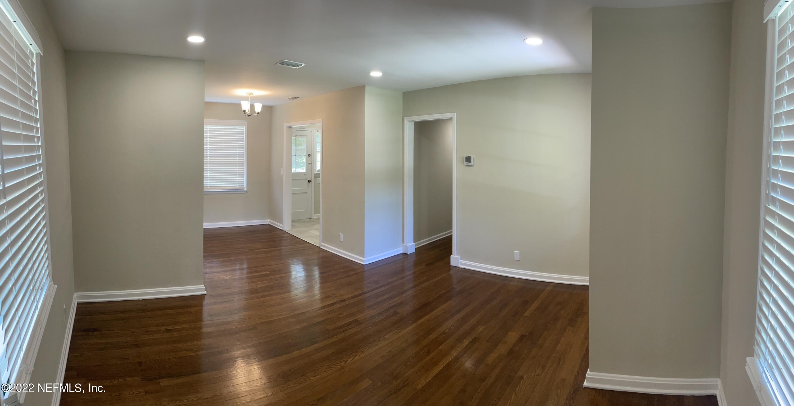 4520 Sunderland Road Jacksonville, FL 32210 - Photo 6 of 17 a view of a hallway with wooden floor