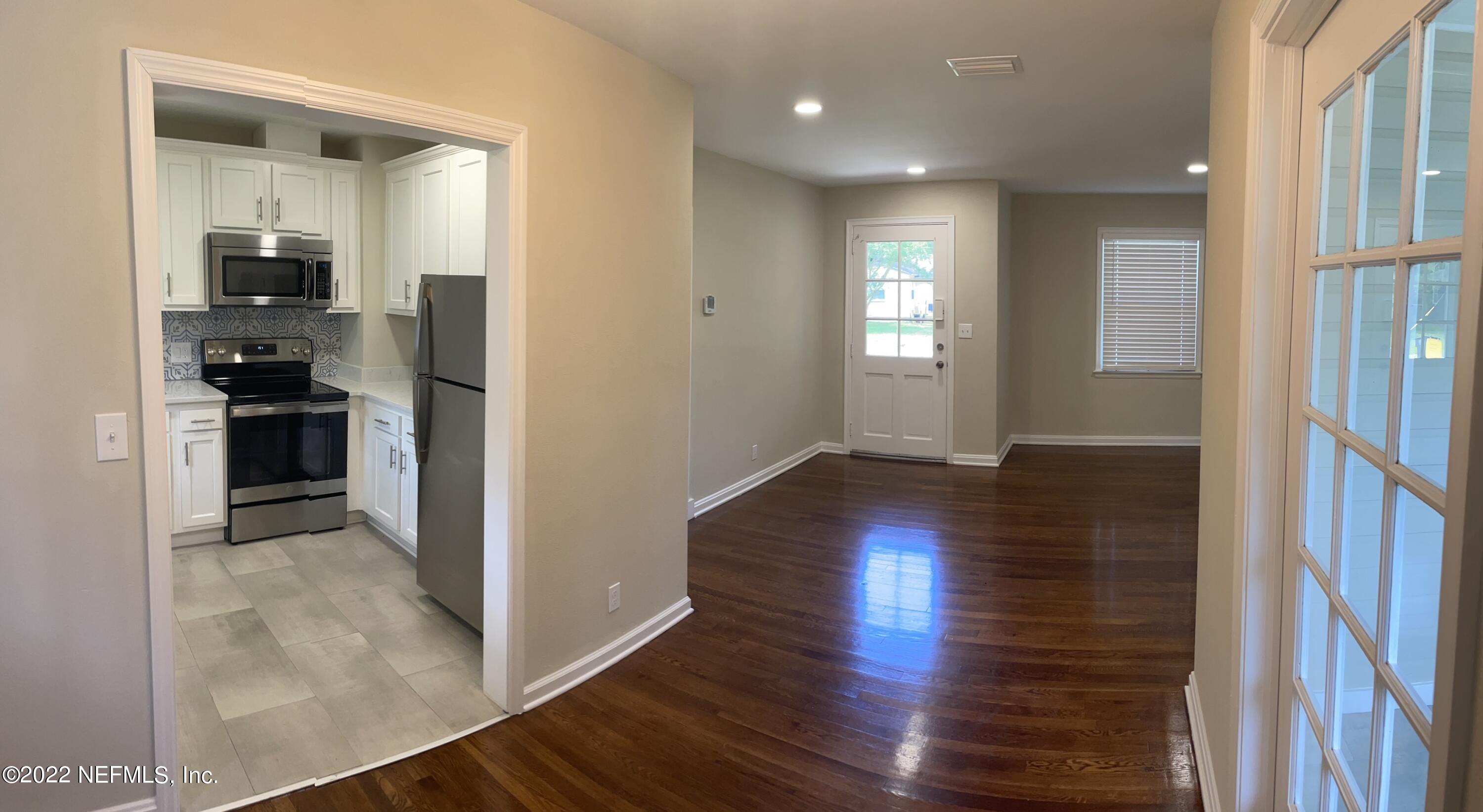 4520 Sunderland Road Jacksonville, FL 32210 - Photo 10 of 17 a view of a kitchen cabinets and wooden floor