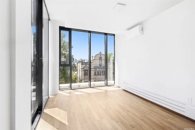 a view of a room with large windows